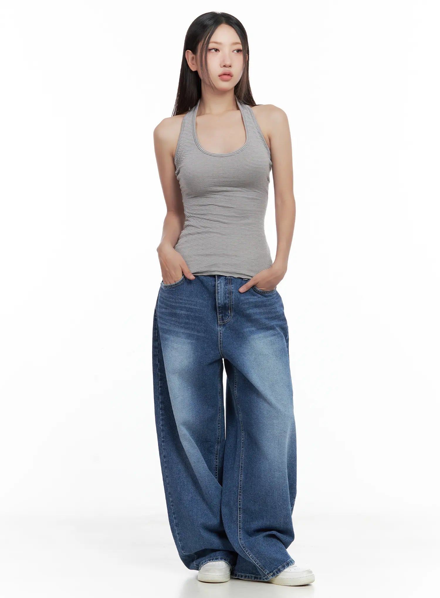 Hayoung Washed Wide-Leg Denim Jeans CL509 in dark blue, full-length front shot on model, hands in pockets, paired with grey striped halter tank and white sneakers, casual street style.