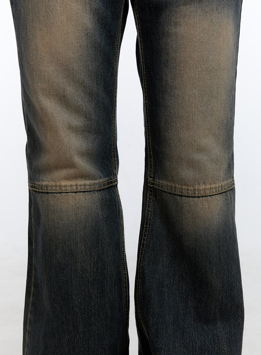 Kira Stitched Detail Bootcut Jeans CG414 in dark blue, close-up detail of knee-area horizontal stitch seam, washed cotton denim with amber fading gradient and subtle bootcut flare visible at hem.
