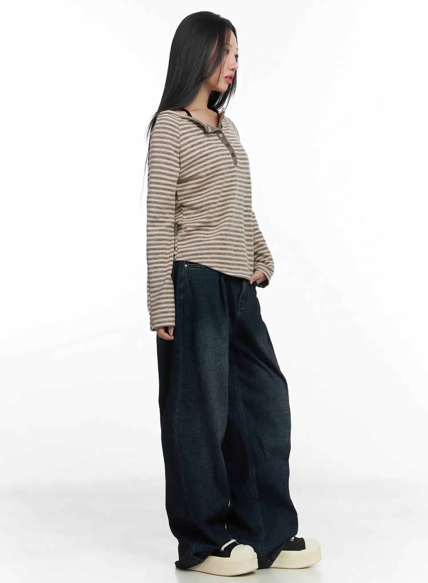 Lettie Fleece Pintuck Wide Leg Jeans CD529 in dark blue, side view on model, long wide-leg washed cotton silhouette with pintuck pleat, paired with striped long-sleeve top and platform sneakers.