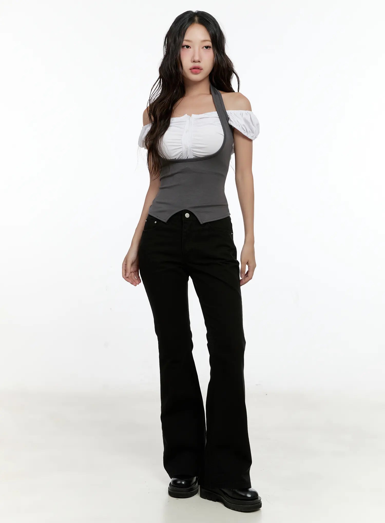 Classic Flare Pants CL531 in black, full-body front shot on model, normal fit with subtle flare hem, styled with off-shoulder white top and black chunky loafers.