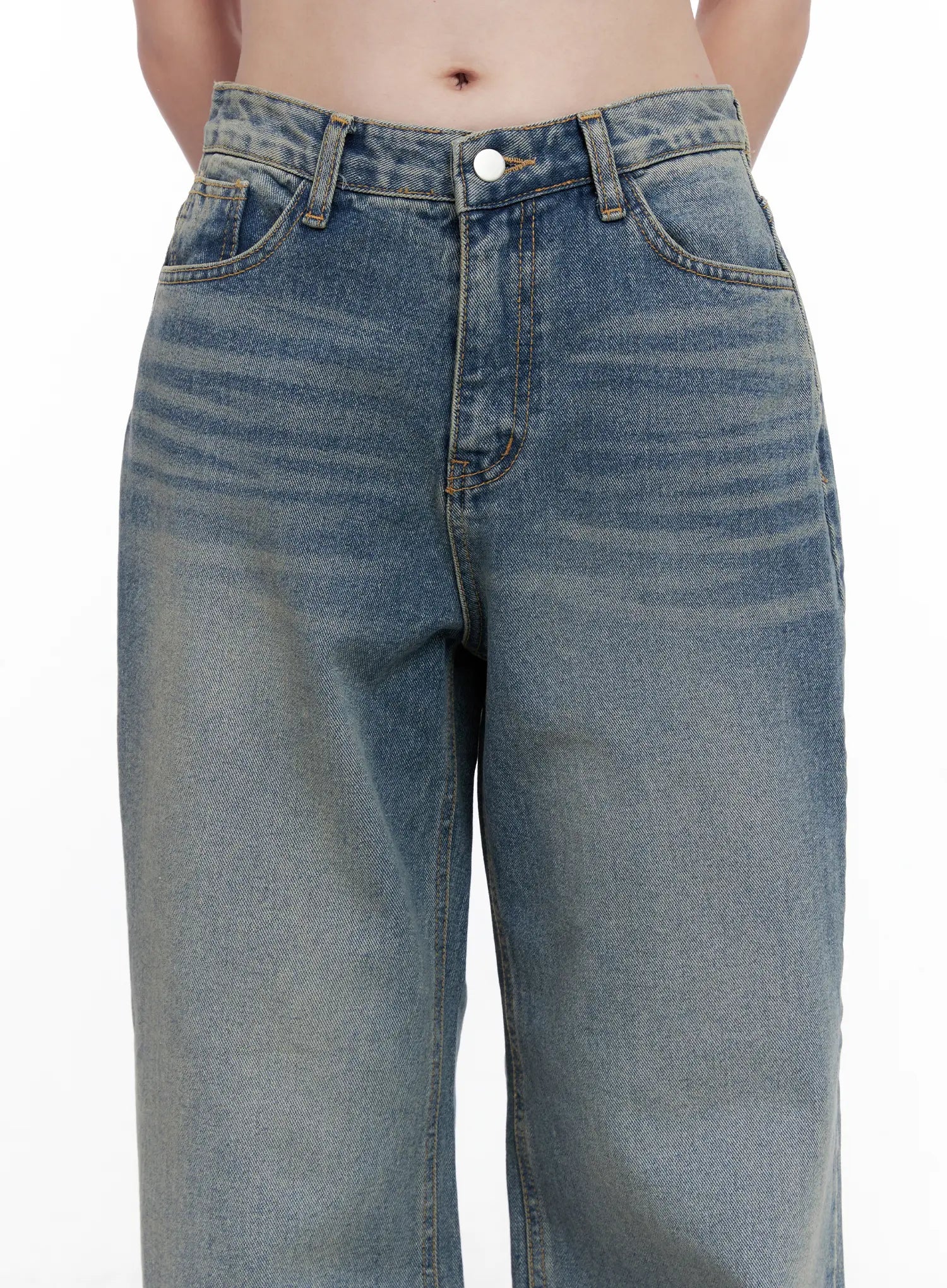 Qu Wide-Leg Vintage Wash Jeans CG521 in blue, close-up waist detail on model, highlighting front pockets, button closure, contrast stitching, and vintage wash fading across thighs.