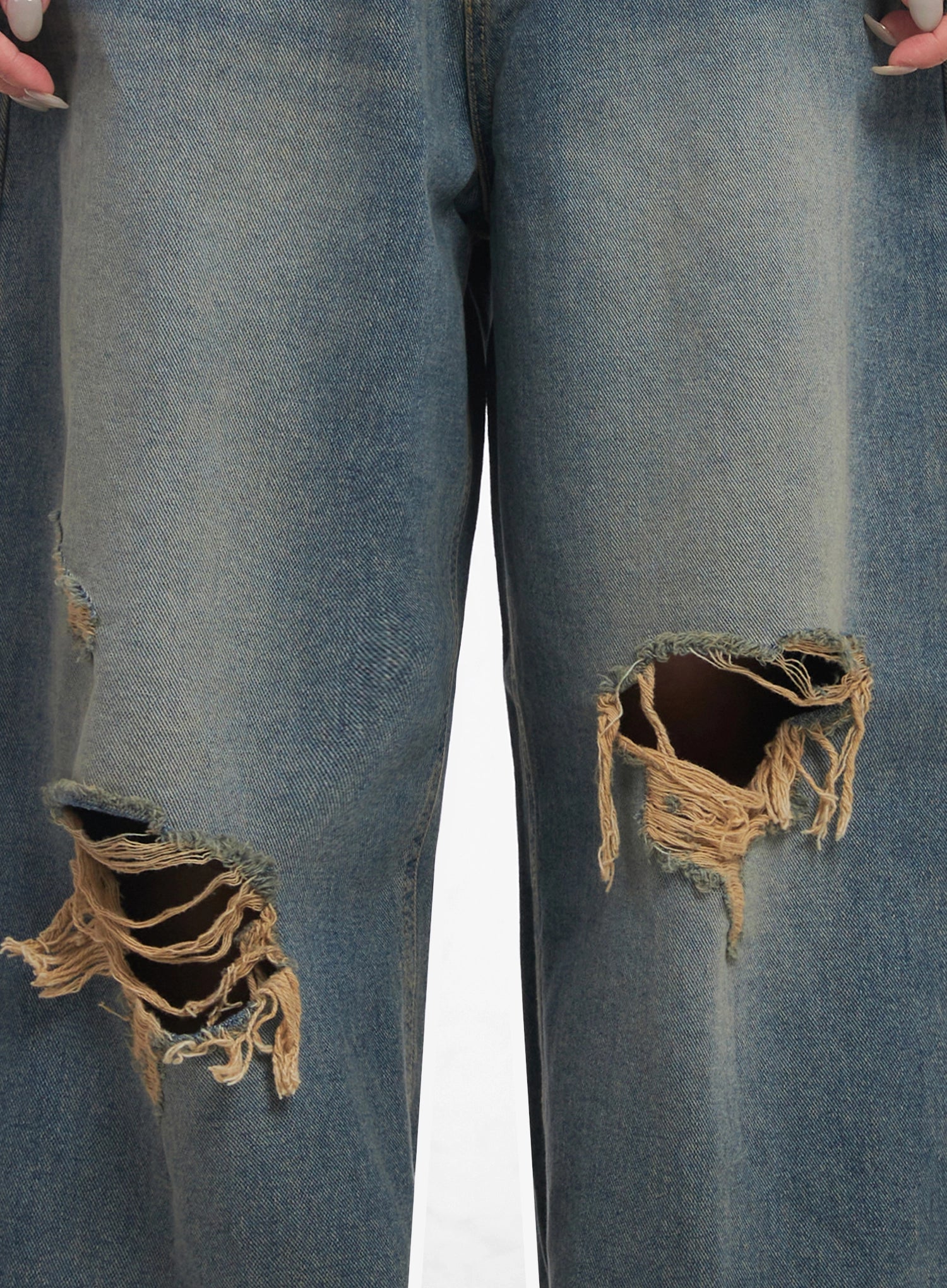 Jeemin Vintage Distressed Wide-Leg Denim Jeans IC503 in washed blue, close-up detail of dual destroyed knee cutouts with raw frayed edges and exposed cotton lining.
