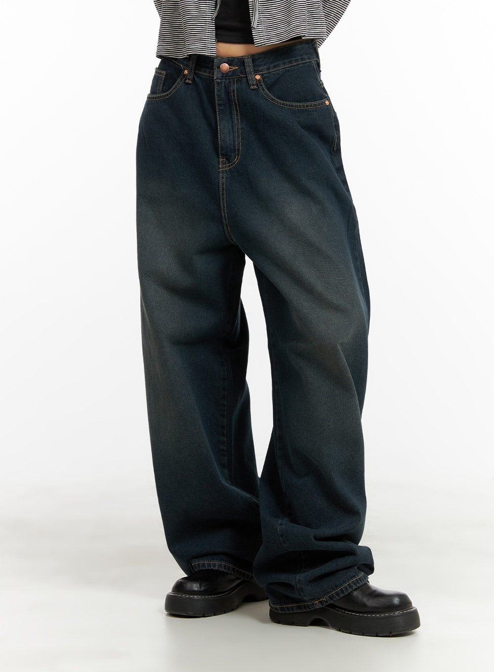 Washed Denim Baggy Jeans CA415 in blue, front mid-shot on model, wide-leg baggy fit with washed denim texture, contrast stitching, floor-pooling hem, worn with striped top and black loafers.