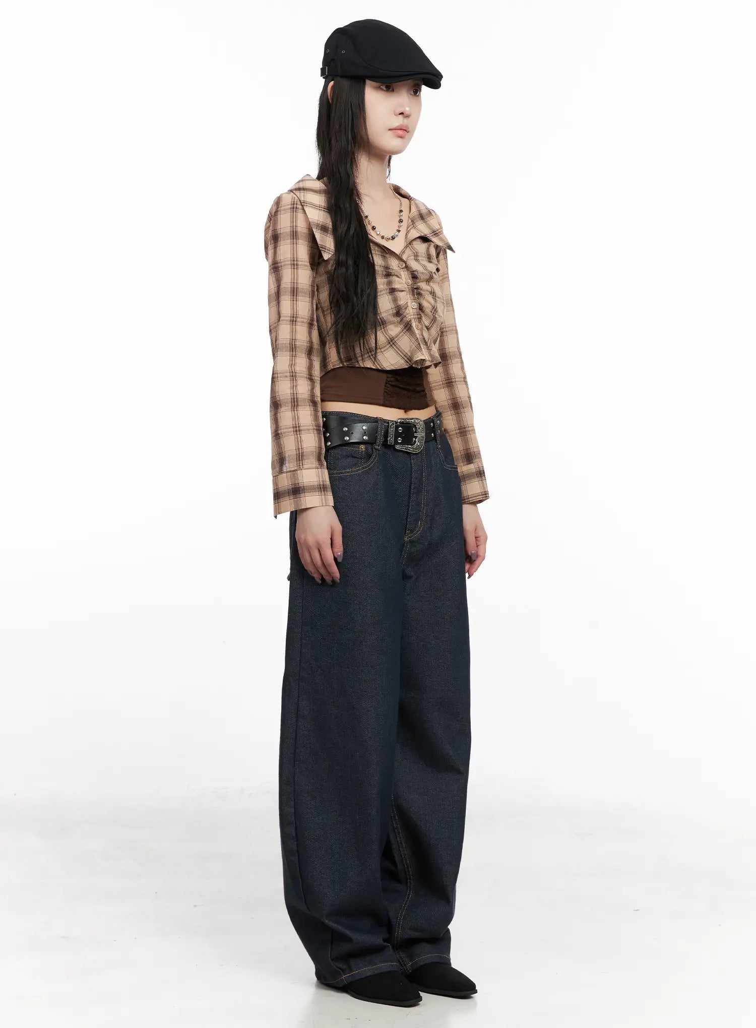 Heaven Wide-Leg Dark Washed Jeans CN513 in dark blue, side full-length view on model, showing wide-leg silhouette and long inseam, paired with plaid crop top and studded belt.