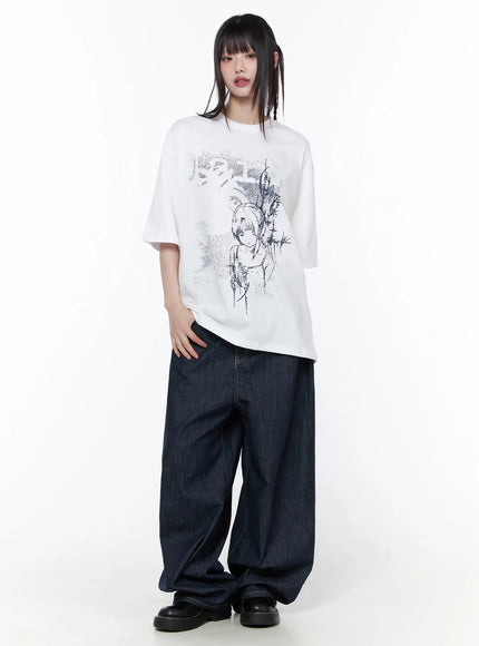 Casual Graphic Short Sleeve Top CU519 in White, full-body front view on model, oversized drop-shoulder silhouette with anime illustration, styled with dark wide-leg denim and black loafers.