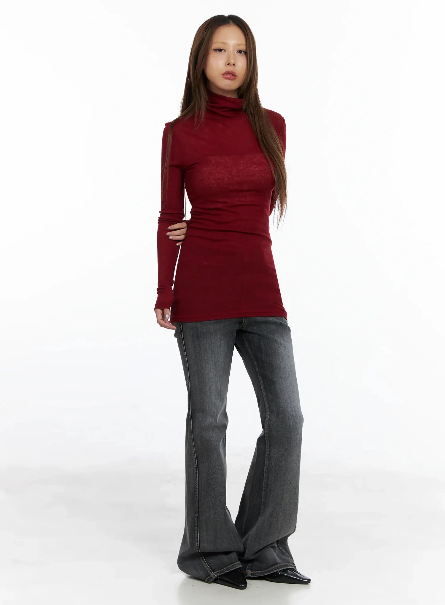 Phoe Flared Jeans ID503 in washed grey, full-length front view on model, normal fit bootcut silhouette, paired with fitted burgundy turtleneck top.