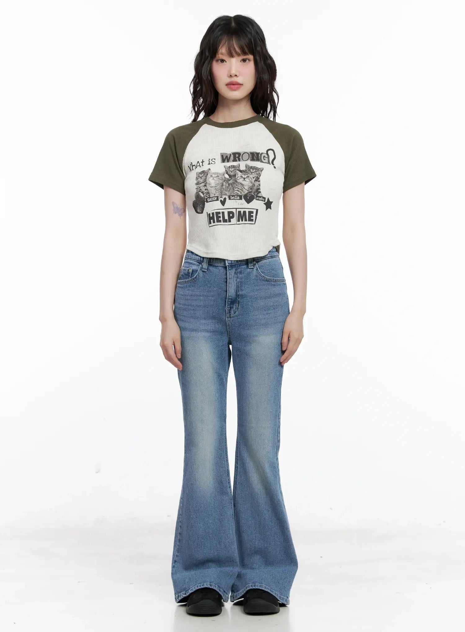 Hikaru High-Waist Flare Jeans IL531 in blue, full-length front view on model, washed denim flare legs, high waist, paired with olive graphic raglan tee, standing straight.