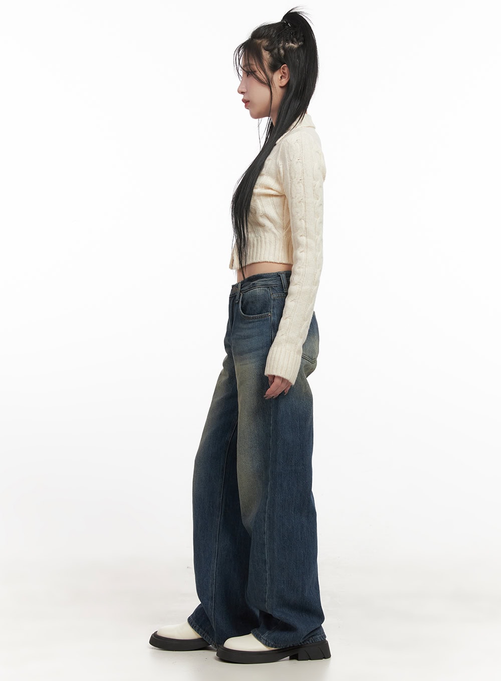 Audrey Washed Wide-Leg Jeans CJ516 in dark blue, side view on model, wide-leg washed denim showing silhouette length and faded detailing, paired with cream cropped cable-knit cardigan.