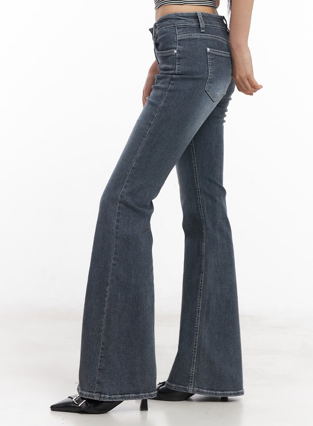 Nadeline Slim Bootcut Jeans CY528 in dark gray, side-back angle close-up on model, showing slim hip fit, rear pocket detail, and flared bootcut hem, washed cotton denim.
