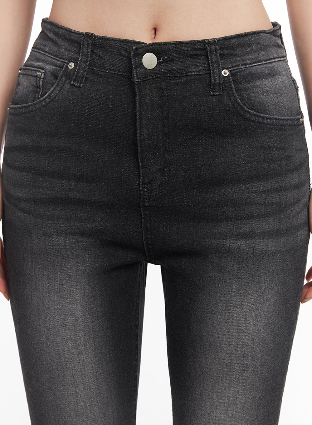 Lior Slim-Fit Bootcut Jeans IY516 in black, close-up detail of waistband and front rise on model, silver button closure, coin pocket, five-pocket washed denim construction visible.