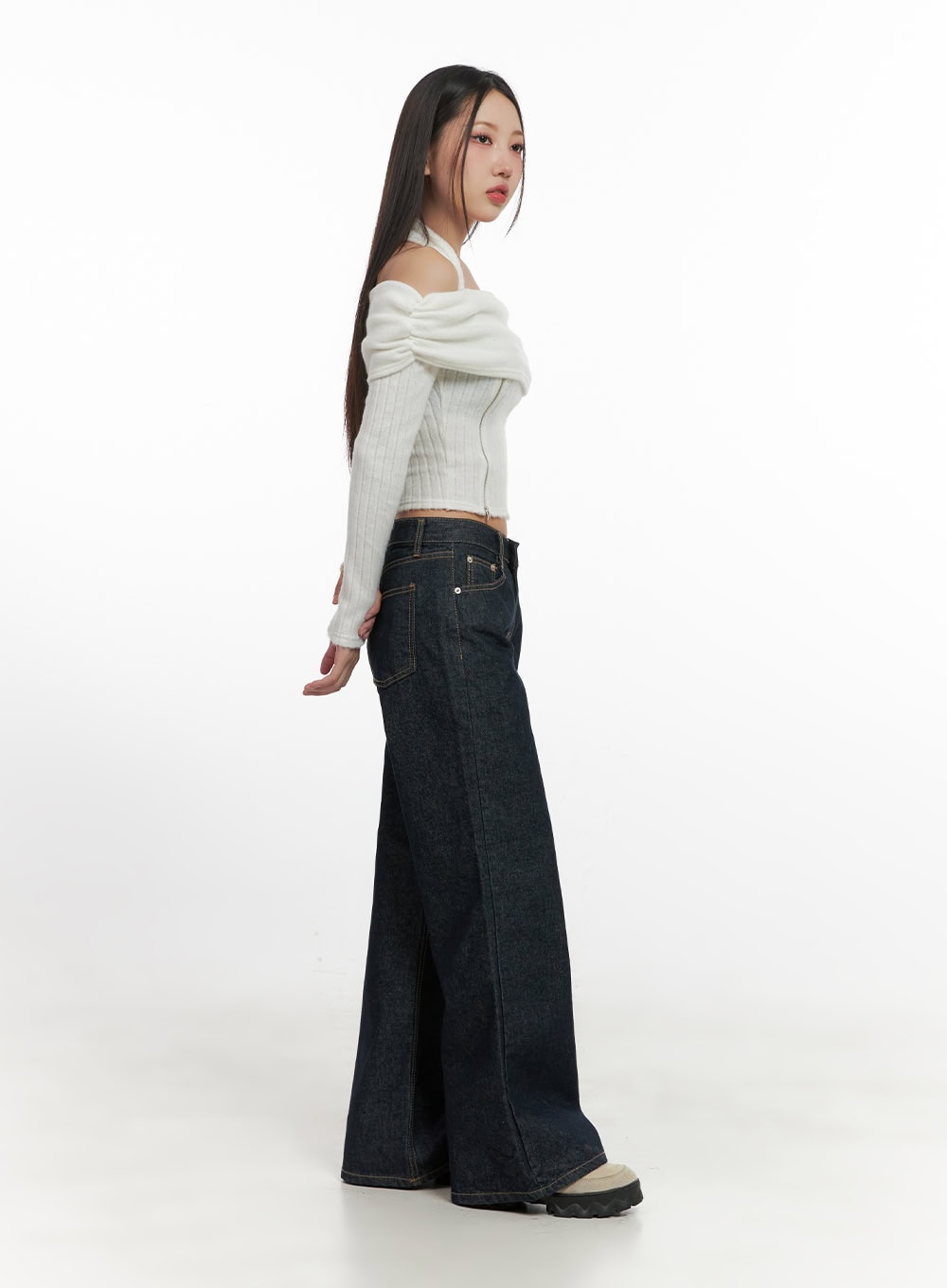 Lisa Cotton Comfort Wide Leg Jeans CN419 in dark blue, side profile full-length shot on model, wide-leg cotton denim with clean seam lines, paired with white off-shoulder knit and chunky boots.