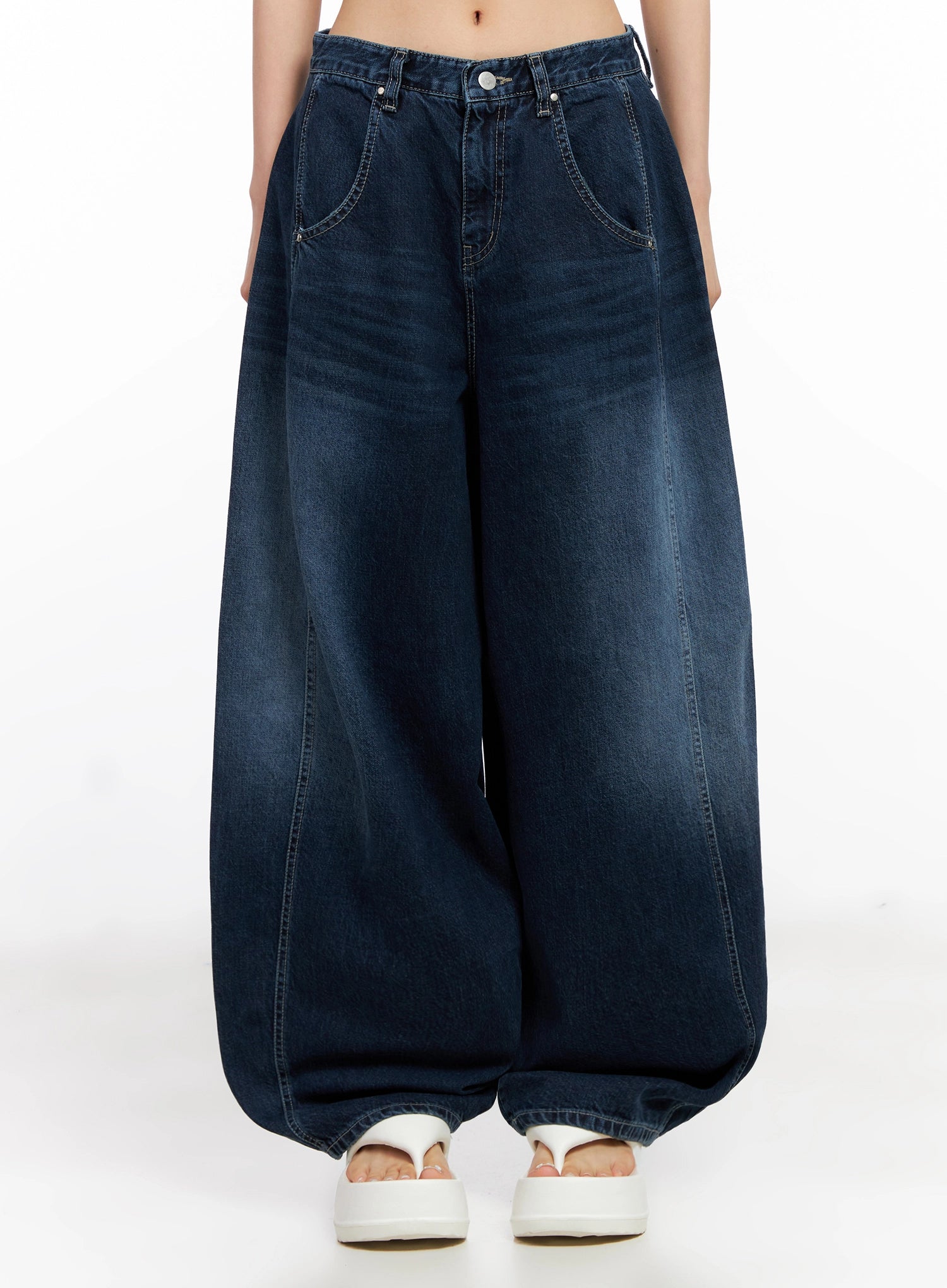 Sohee Angel Wing Print Wide-Leg Jeans IG508 in dark blue, front lower-body shot on model, oversized barrel-leg silhouette with washed finish, front pockets, and silver button closure.
