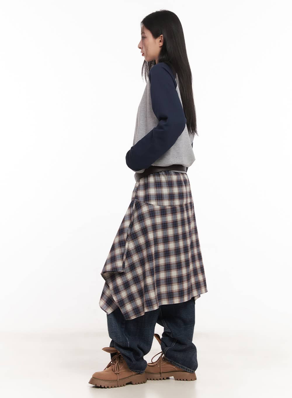 Annie Washed Wide-Leg Jeans CM518 in dark blue, side view on model, wide-leg washed denim pooling at hem, styled with asymmetric plaid skirt overlay and brown lace-up boots.