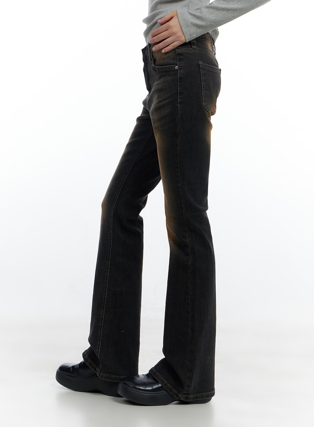Harley Slim Washed Denim Bootcut Jeans CS420 in Blue, side view on model, slim fit through thigh flaring to bootcut hem, amber wash highlight visible at knee, cotton-spandex denim stretch.