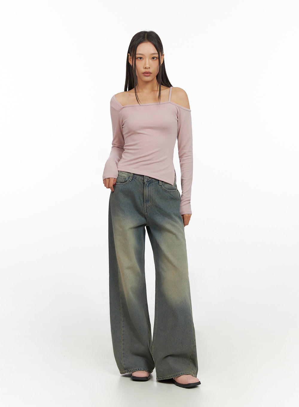 Inez Washed Denim Wide Leg Jeans IS427 in vintage green, front three-quarter view on model, relaxed wide-leg silhouette with sun-faded wash, styled with pink long-sleeve top.