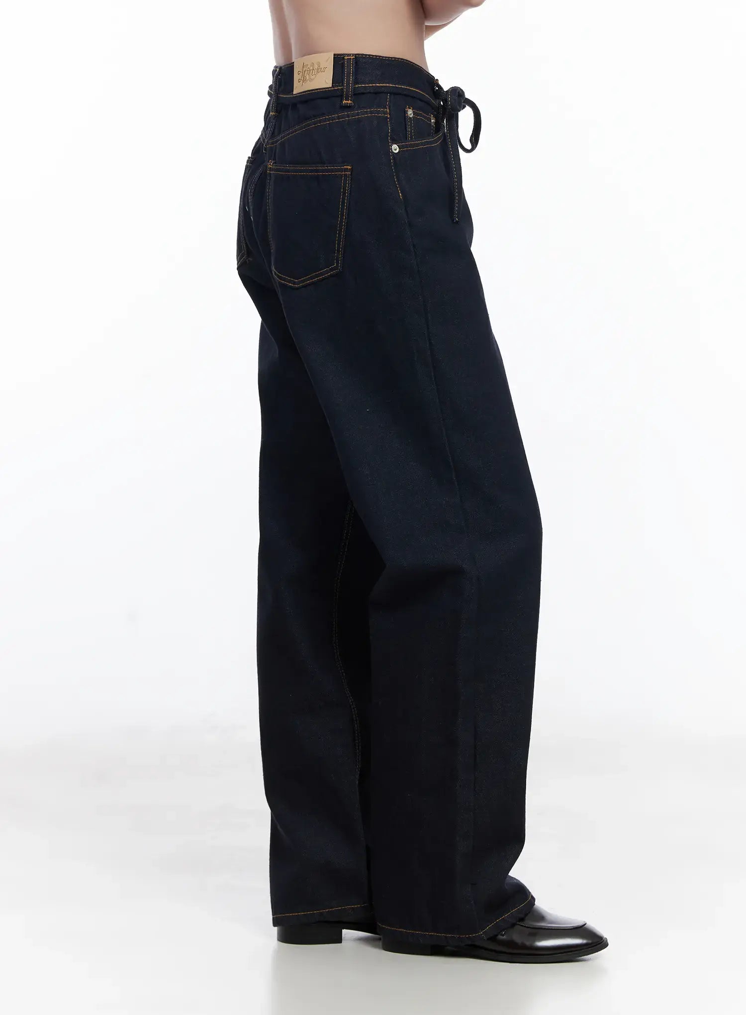 Mingi Non-Fade Semi-Wide Belted Jeans CJ519 in dark blue, side view on model, showing tie belt at waist, contrast orange topstitching, back pocket and wide-leg drape.