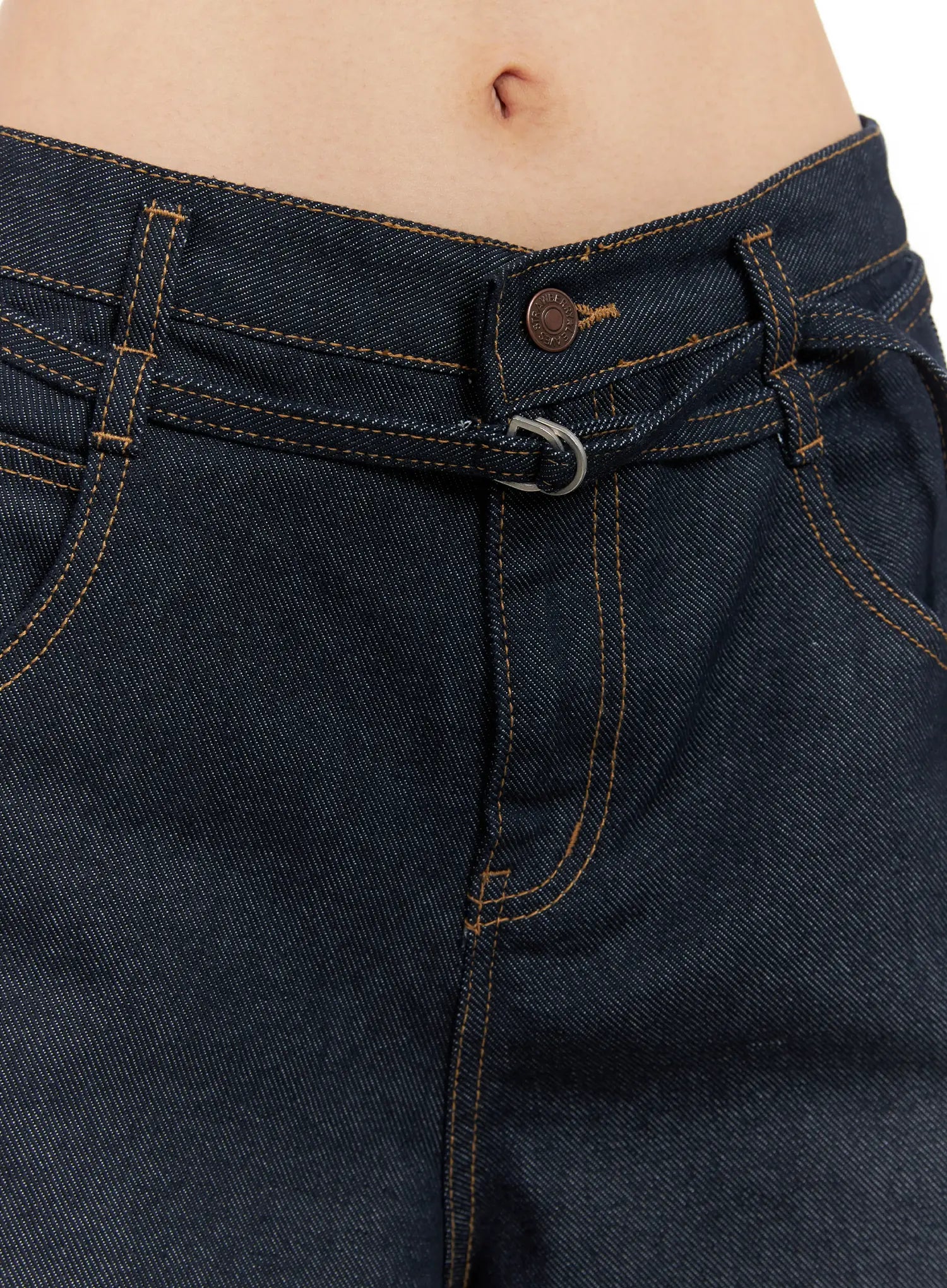 Alanna Sun Belt Baggy Jeans CO528 in dark indigo, waistband close-up showing sun belt ring detail, contrast topstitching, front pockets, and copper button on model.