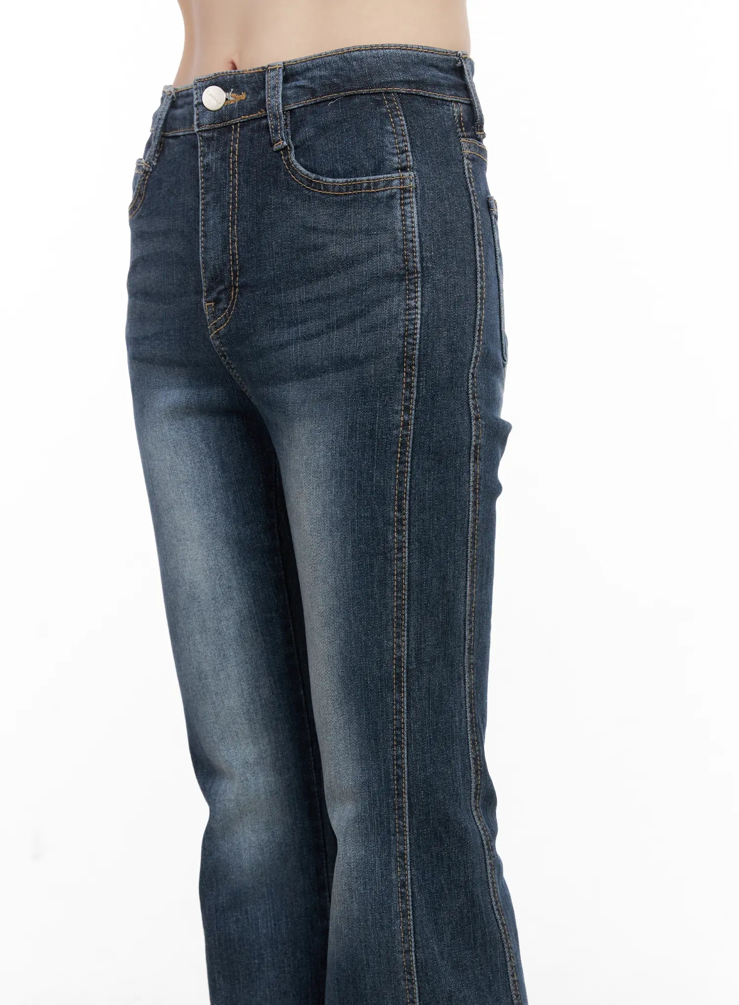 Giana High Waist Hip Pad Flare Jeans CG519 in blue, side close-up on model, highlighting hip pad shaping, front pocket stitching, and washed denim texture.