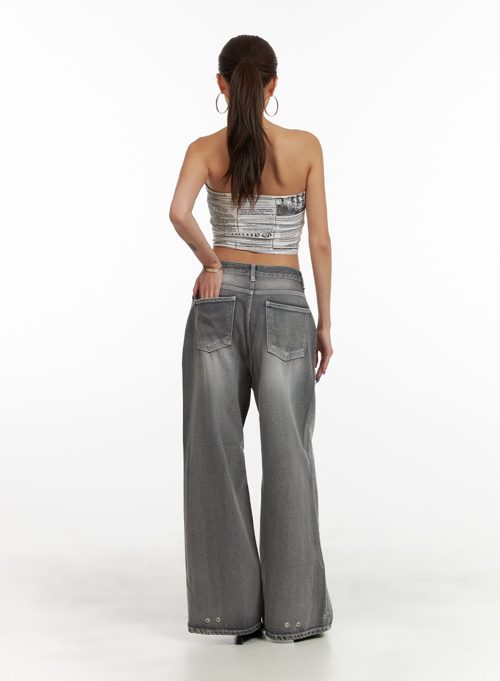 Low Rise Baggy Jeans CY431 in gray, back full-length view on model, showing dual back patch pockets and eyelet hem detail, wide baggy fit.