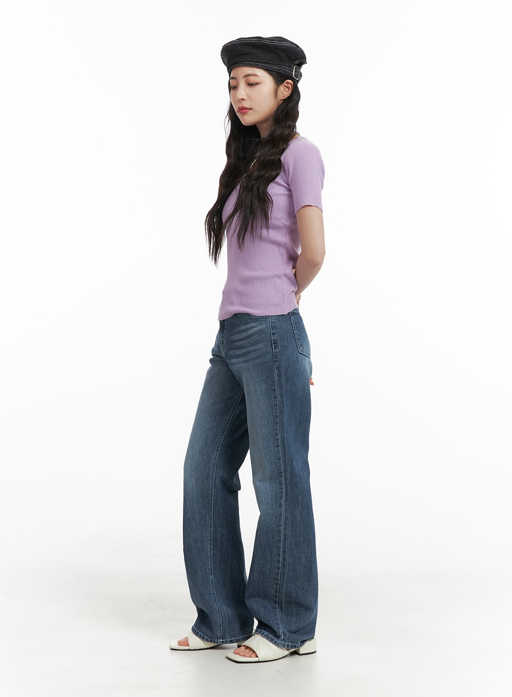 Recycled Light Washed Straight Jeans OM425 in blue, side view full-length on model, straight leg silhouette with subtle fading, styled with purple ribbed tee and white mule sandals.