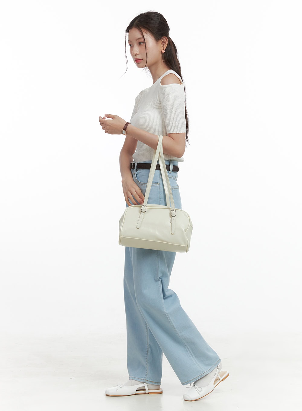 Washed Low Rise Loose Straight Jeans OL416 in light blue, side profile full-body shot on model, loose straight washed denim with low rise waist and belt, paired with white cold-shoulder top and cream bag.