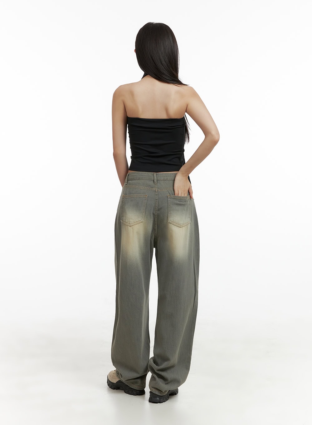 Washed Baggy Denim Jeans CU404 in Brown, full back view on model, wide-fit washed denim with faded seat detail, back patch pockets, paired with black tube top.