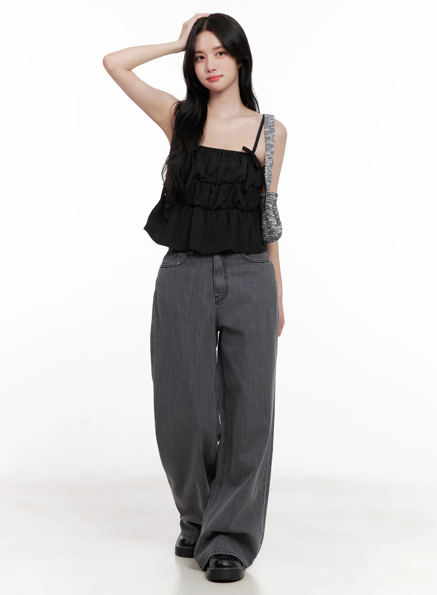 Jiyeon Dark Gray Denim Jeans CL516 in dark gray, front full-body shot on model with relaxed pose, wide-leg cotton denim paired with black cami top and knit arm warmer.