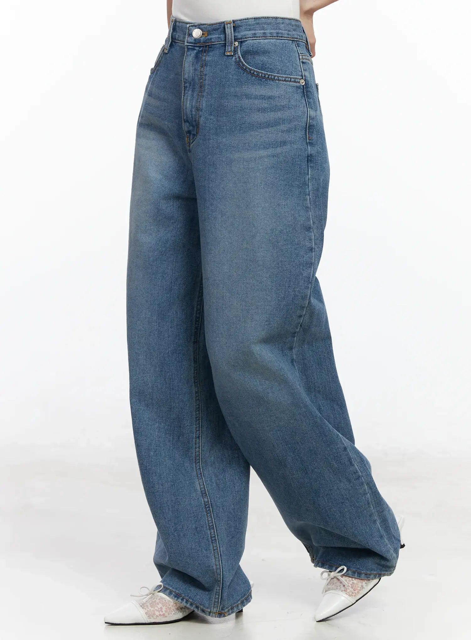 Ensley Wide Leg Jeans IJ529 in blue, side-angle shot on model, washed cotton wide leg showing voluminous drape from hip to hem, front pocket detail visible.