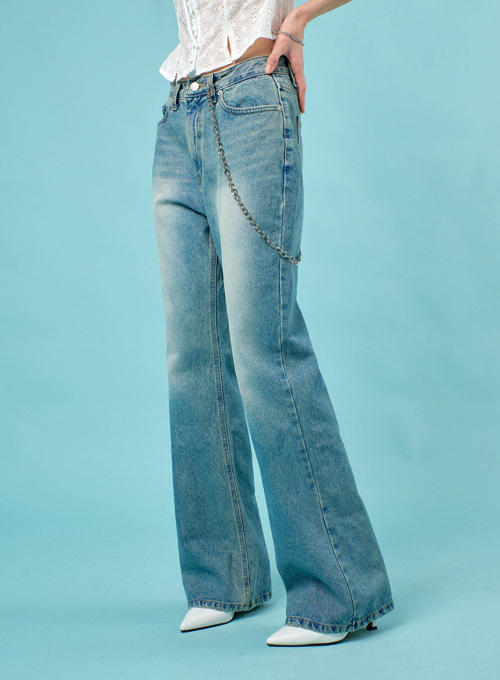 Washed Straight Leg Bootcuts Jeans IJ430 in light blue, side close-up on model, showing straight-to-flare leg, washed fading, front pockets, and silver chain detail at waistband.
