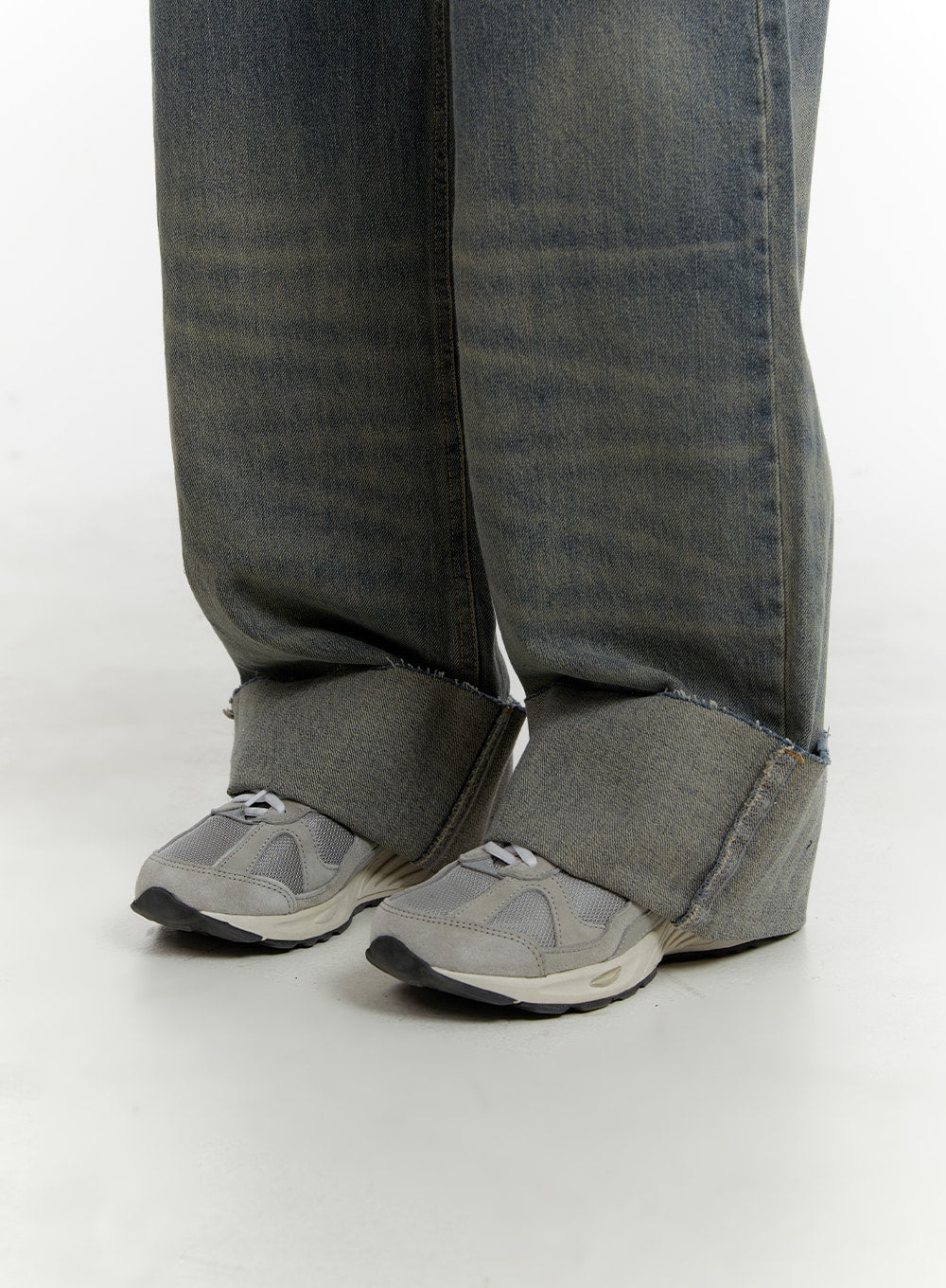 Washed Straight Leg Roll-Up Jeans CA401 in blue, close-up of rolled-up hem detail, raw-edge cuff folded over grey sneakers, showing contrast inner denim and washed fade at hem.