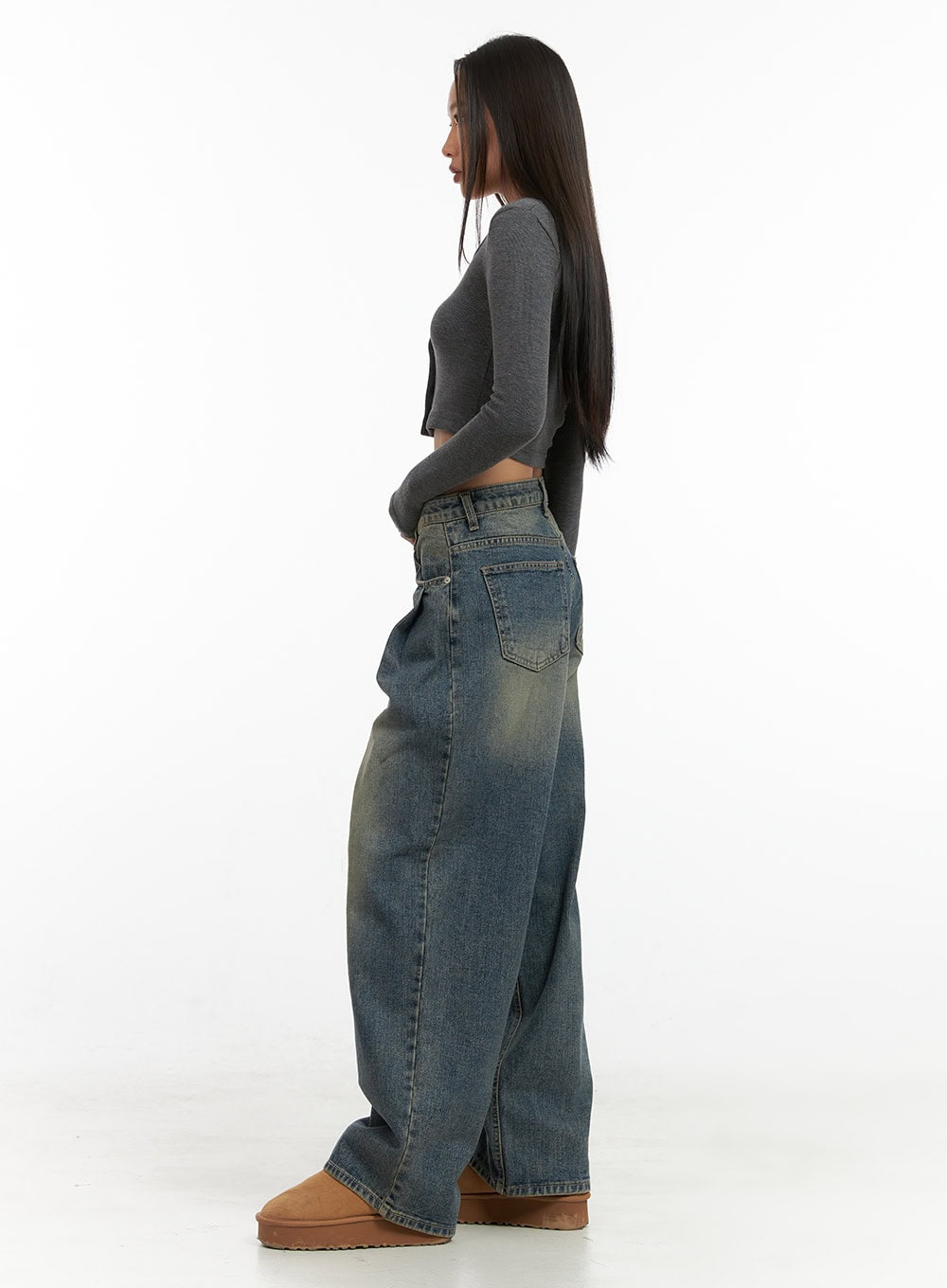 Peyton Pin-Tuck Washed Baggy Jeans CO424 in blue, full-body side view on model, exaggerated wide baggy leg with washed cotton denim, styled with grey crop top and tan platform boots.