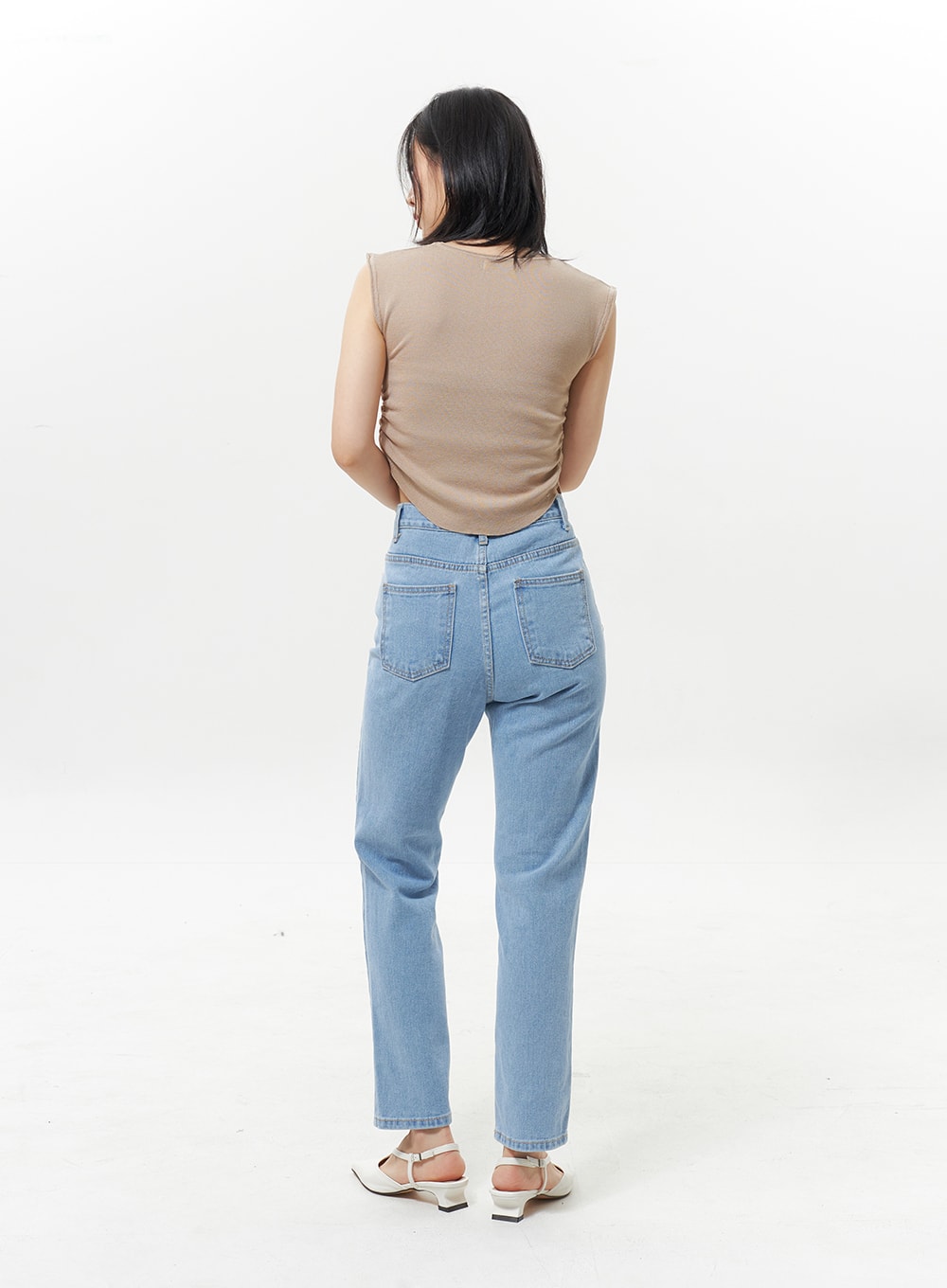 High Waist Jeans OY330 in light blue, full back model shot, showing dual back patch pockets and straight leg cut, worn with beige tank and white slingback mules.