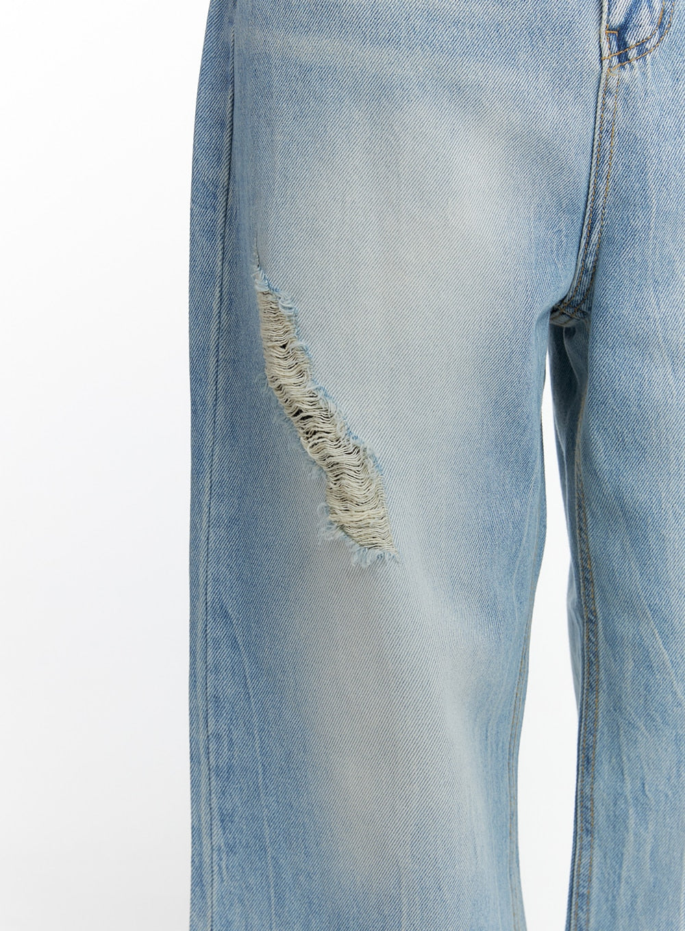 Distressed Wide-leg Jeans CF419 in light blue, close-up detail of thigh-area destroy, diagonal frayed rip with exposed white cotton threads on washed denim fabric.