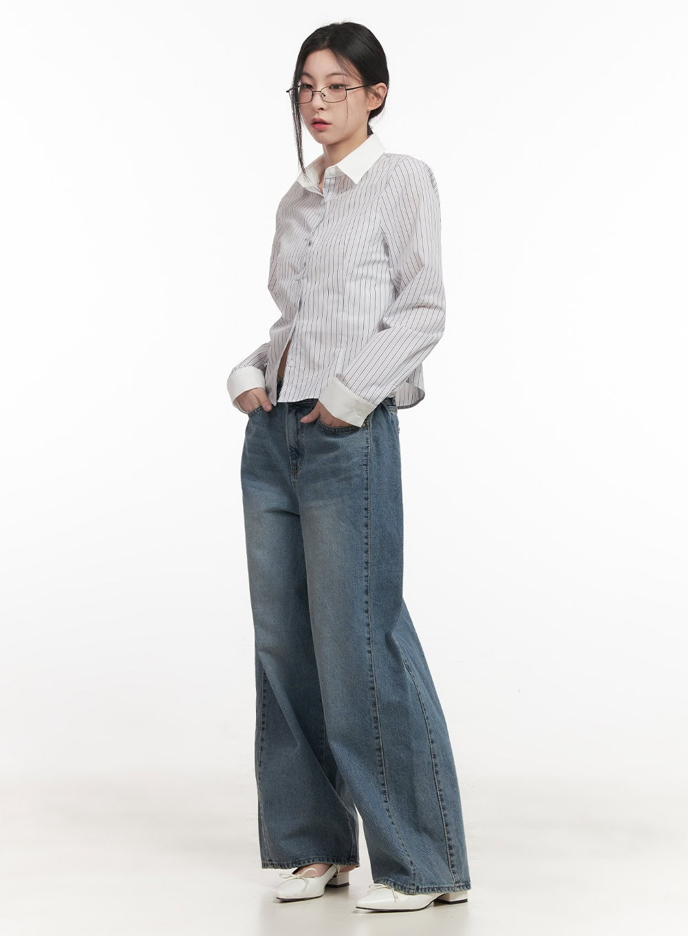 Andrea Wide-Leg Jeans CF514 in blue, three-quarter side styling shot, model hands in pockets, wide-leg washed cotton denim with pintuck, paired with striped cropped shirt.
