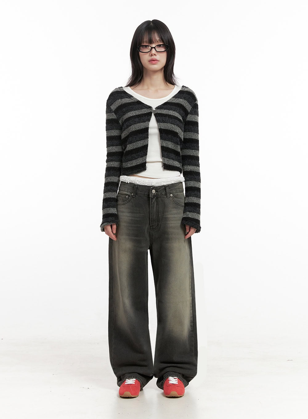 Matilda Wide-Fit Baggy Jeans ID402 in black, full-body front standing shot on model, washed baggy denim with green-tinted fade, styled with striped crop cardigan and white layered top.