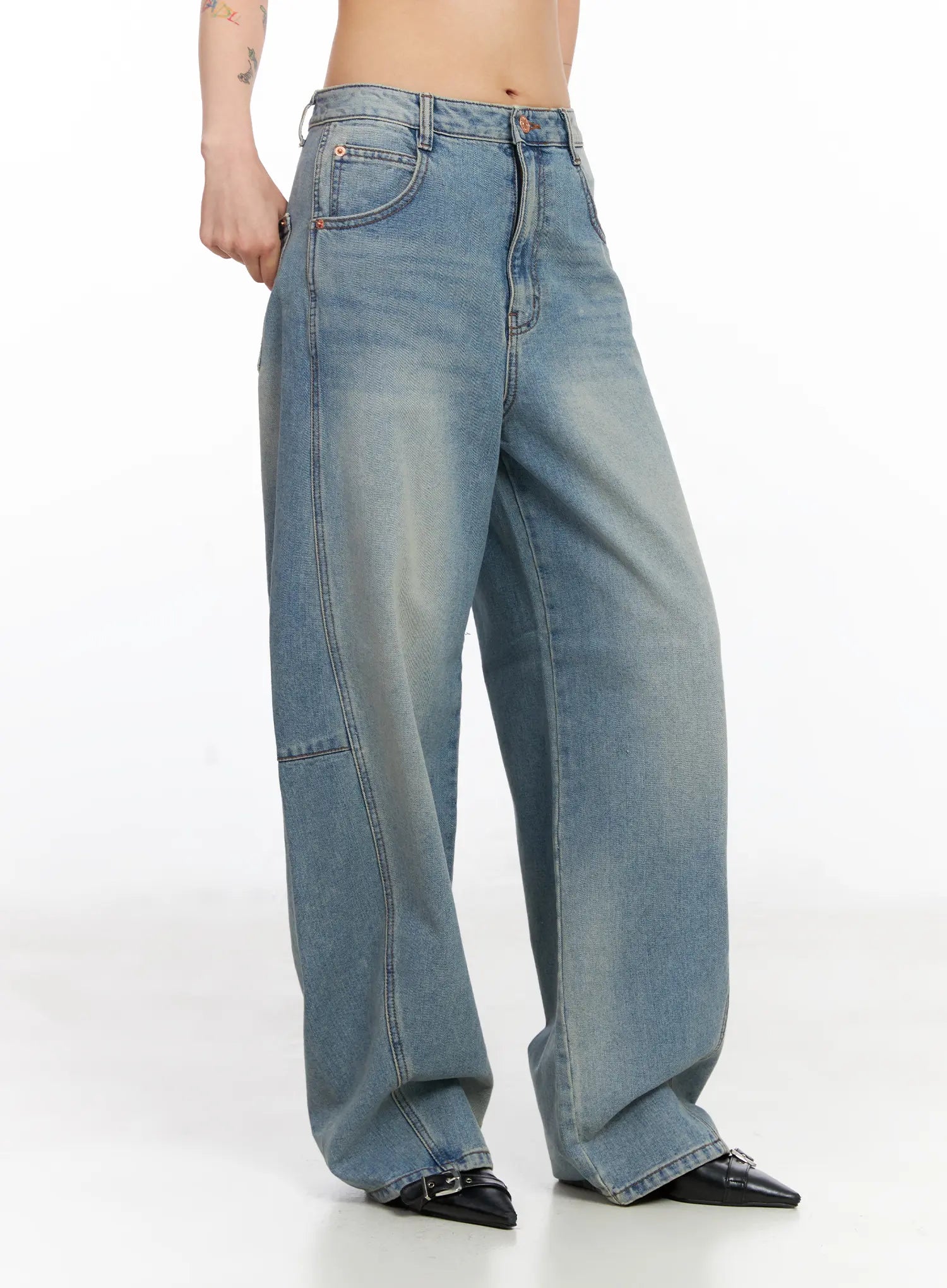 Frey Washed Wide-Leg Jeans CJ523 in light blue, side angle on model, highlighting curved panel seams, high-rise waist, patch pocket, and washed cotton finish.