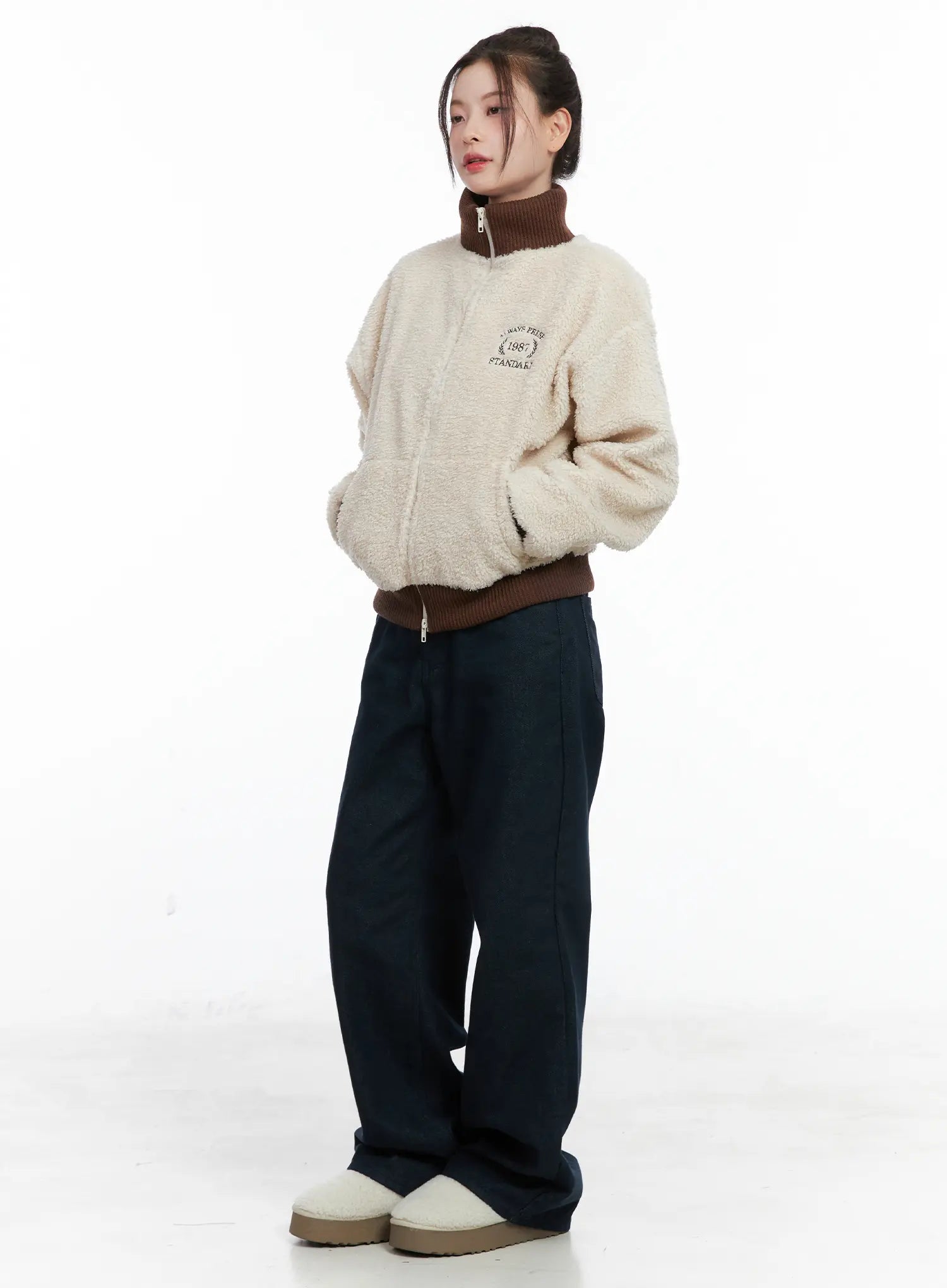 Drew Non-Fade Relaxed Fit Wide Jeans CN519 in dark blue, side-angle full-body styling shot, model in boucle zip jacket with hands crossed, wide leg length grazing floor.