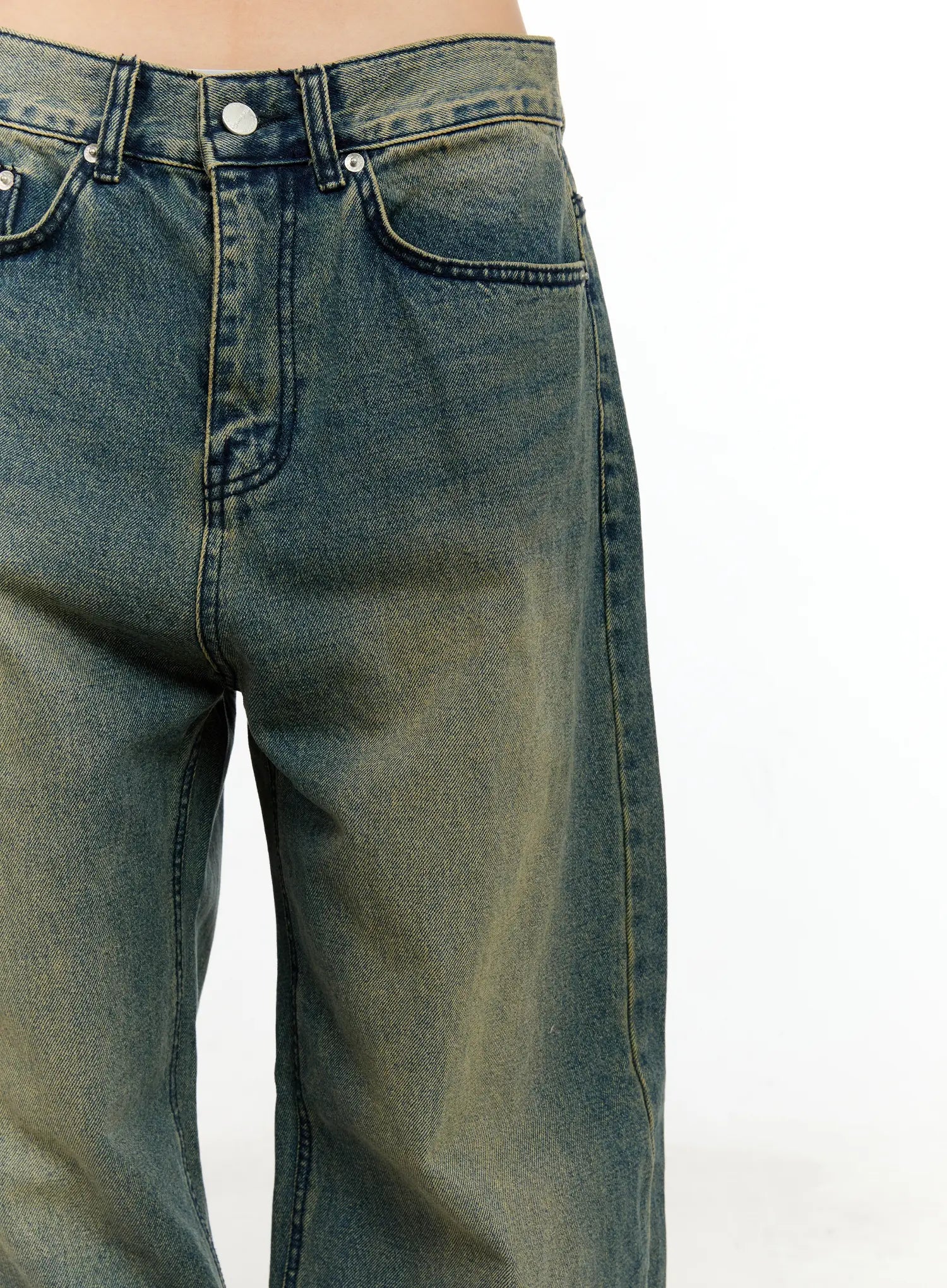 Sooyoung Baggy Vintage Wash Jeans CL531 in dark blue, waistband close-up on model, showing button fly, front pockets, yellow topstitching, and vintage faded wash detail.