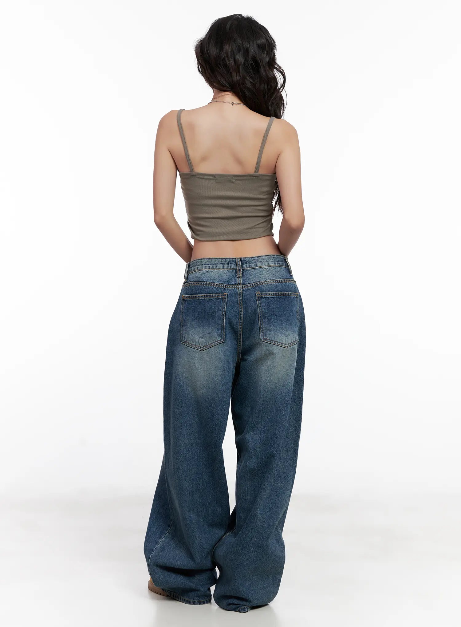 Miji Wide-Leg Washed Denim Jeans CL521 in dark blue, full back view on model, two back pockets with topstitching, washed cotton with volume at hem, styled with khaki spaghetti-strap cami.