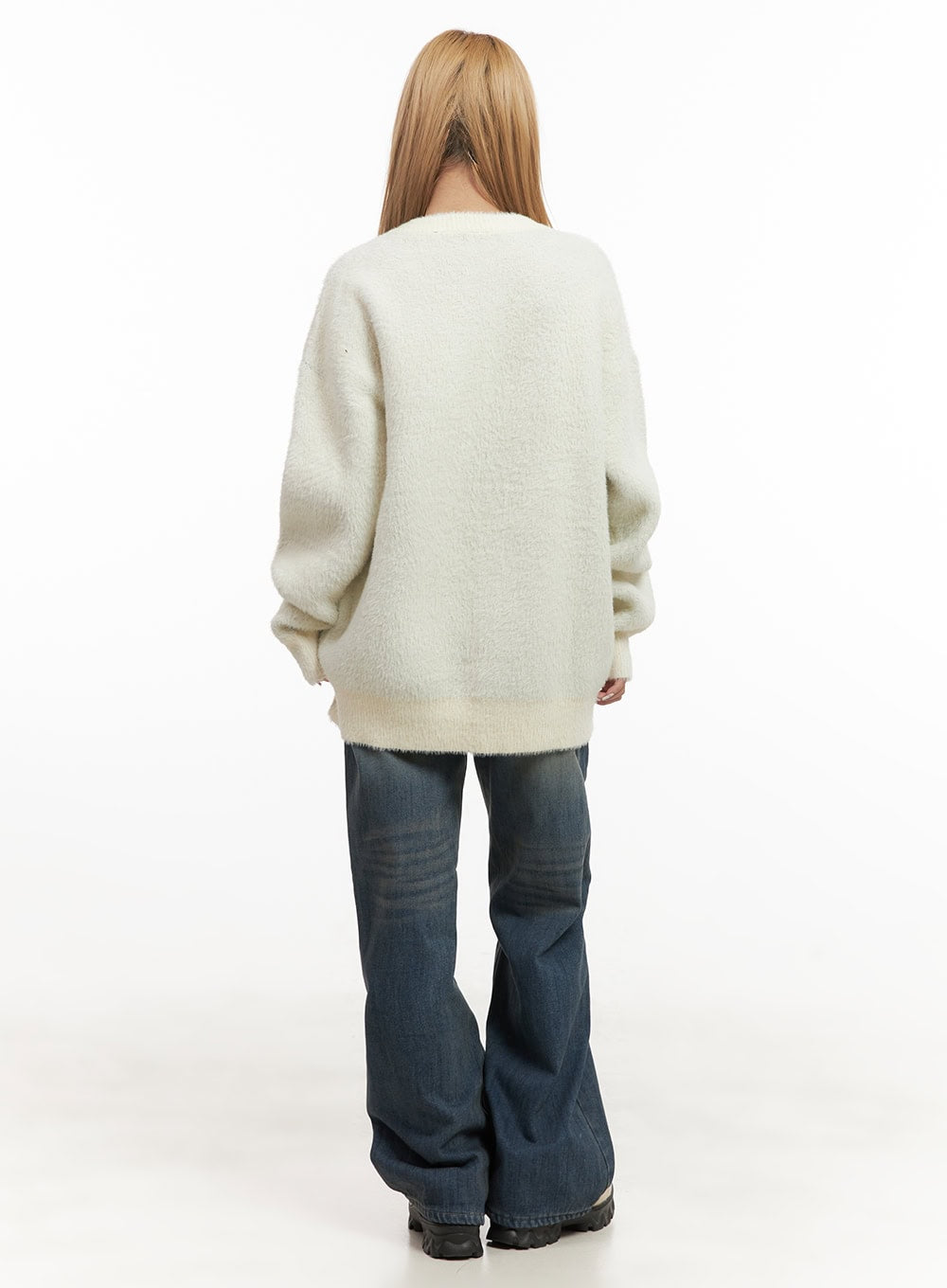 Michelle Washed Wide-Leg Jeans CJ508 in blue, back full-body shot on model, wide-leg washed cotton denim with subtle fading, paired with cream fuzzy sweater and chunky boots.