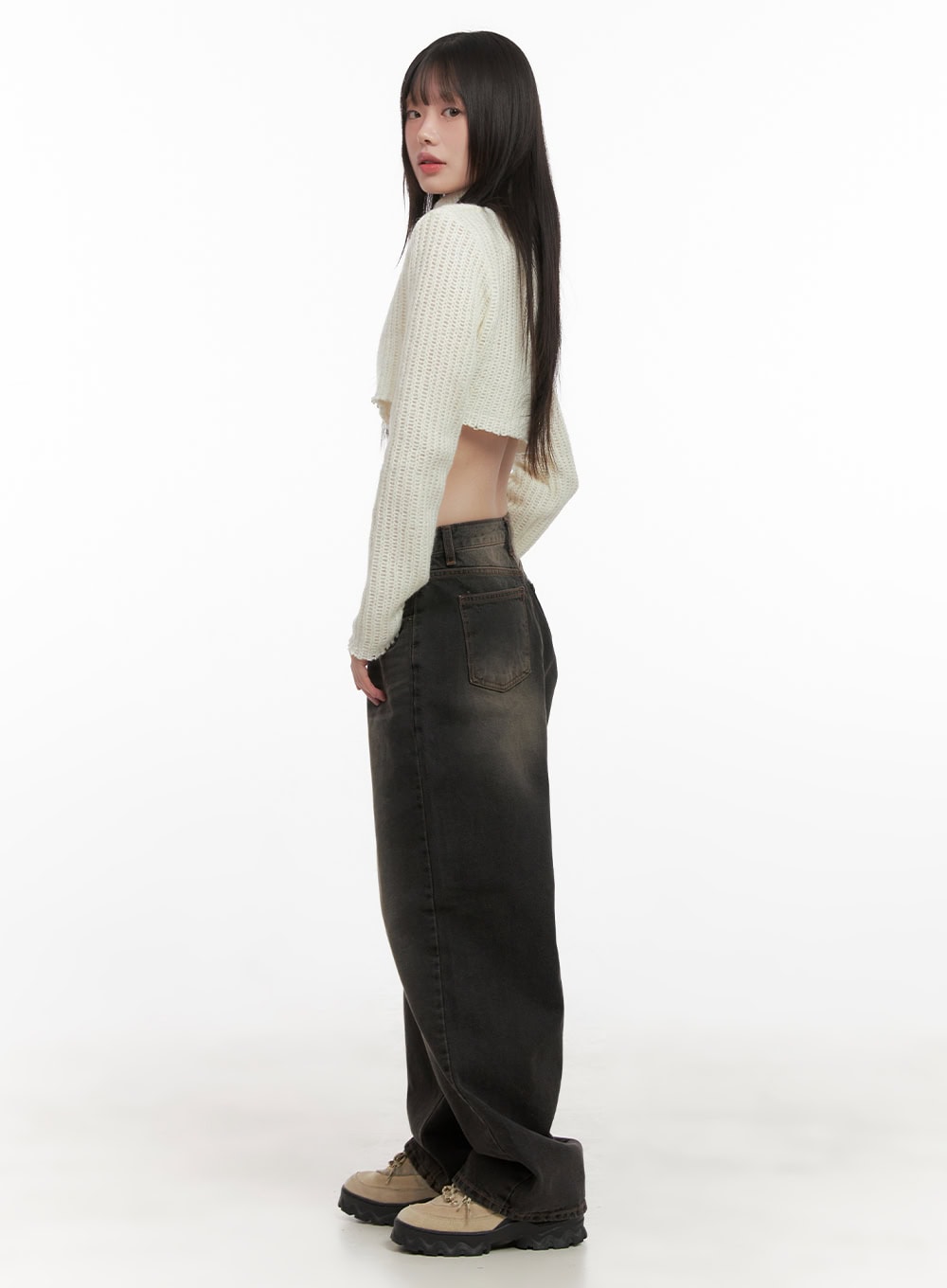 Celina Washed Baggy Wide-Leg Jeans CD426 in black, side profile shot on model, washed cotton denim showing back pocket and wide-leg silhouette, styled with cream knit crop top and lug-sole sneakers.