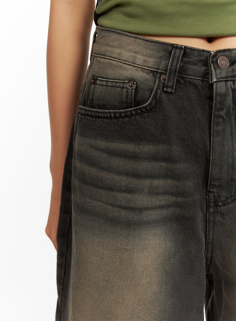 Color Washed Jorts IY422 in black washed denim, close-up of waistband and front pocket detail, showing coin pocket, rivet hardware, and gradient color-wash texture on cotton denim.