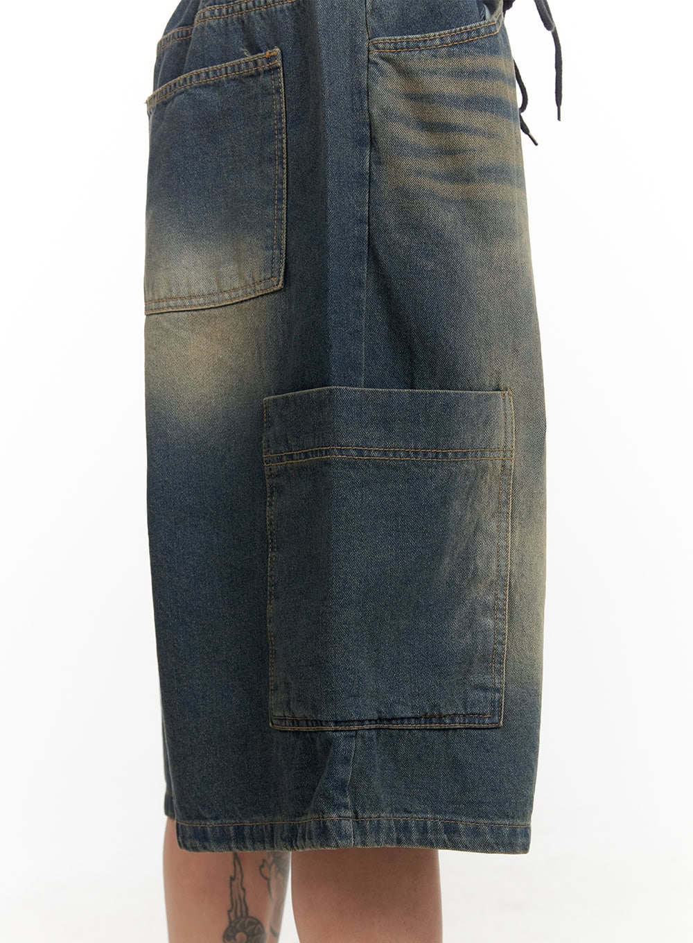 Men's Denim Washed Shorts (Blue) IL404 in blue, close-up side detail on model, highlighting large patch cargo pocket, drawstring waist, and yellow-tinted washed denim texture.