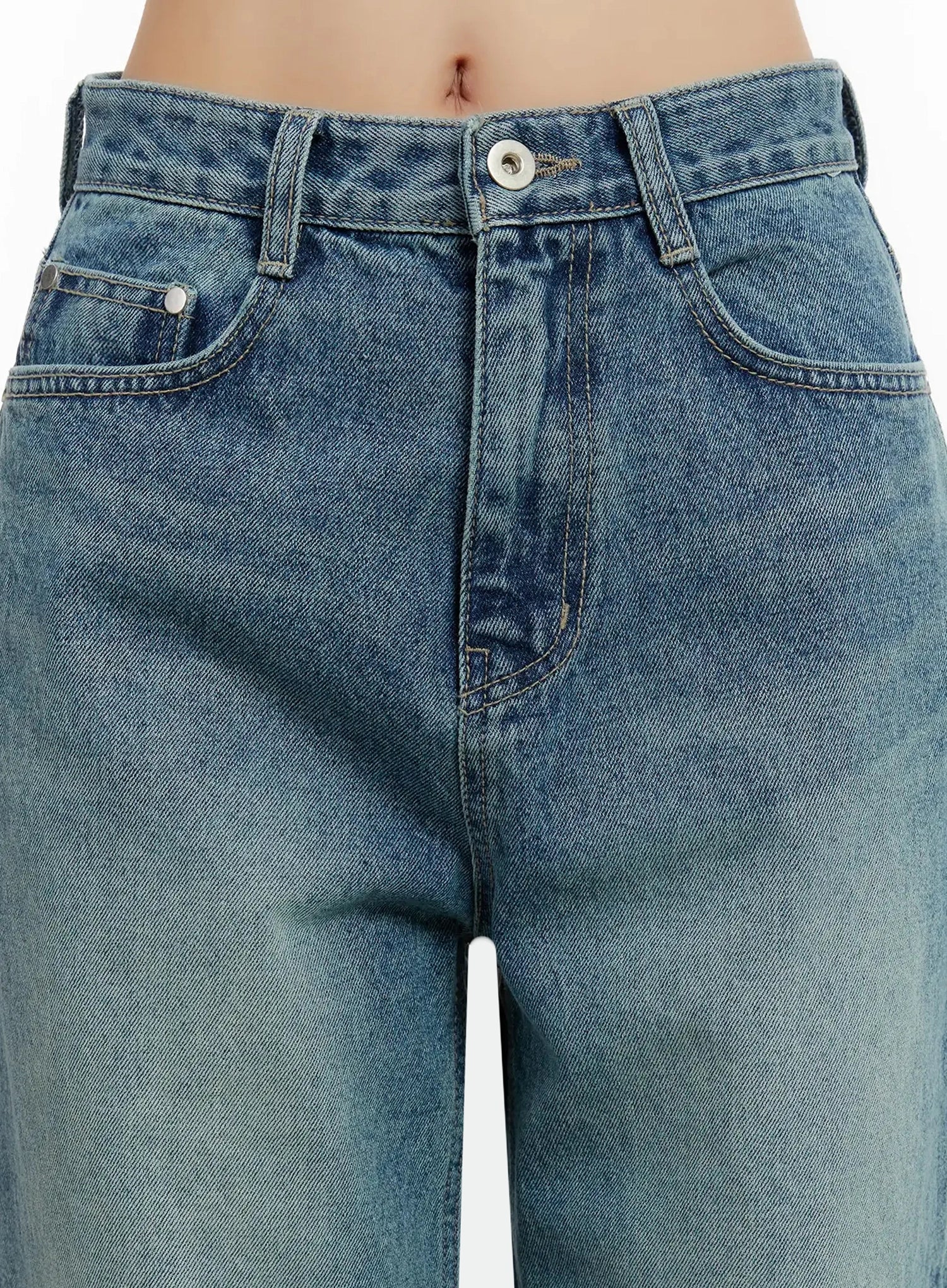 Pixi Straight Leg Jeans ID525 in blue, close-up front detail on model, highlighting mid-rise waistband, silver button, front pockets, and contrast topstitch on washed cotton denim.