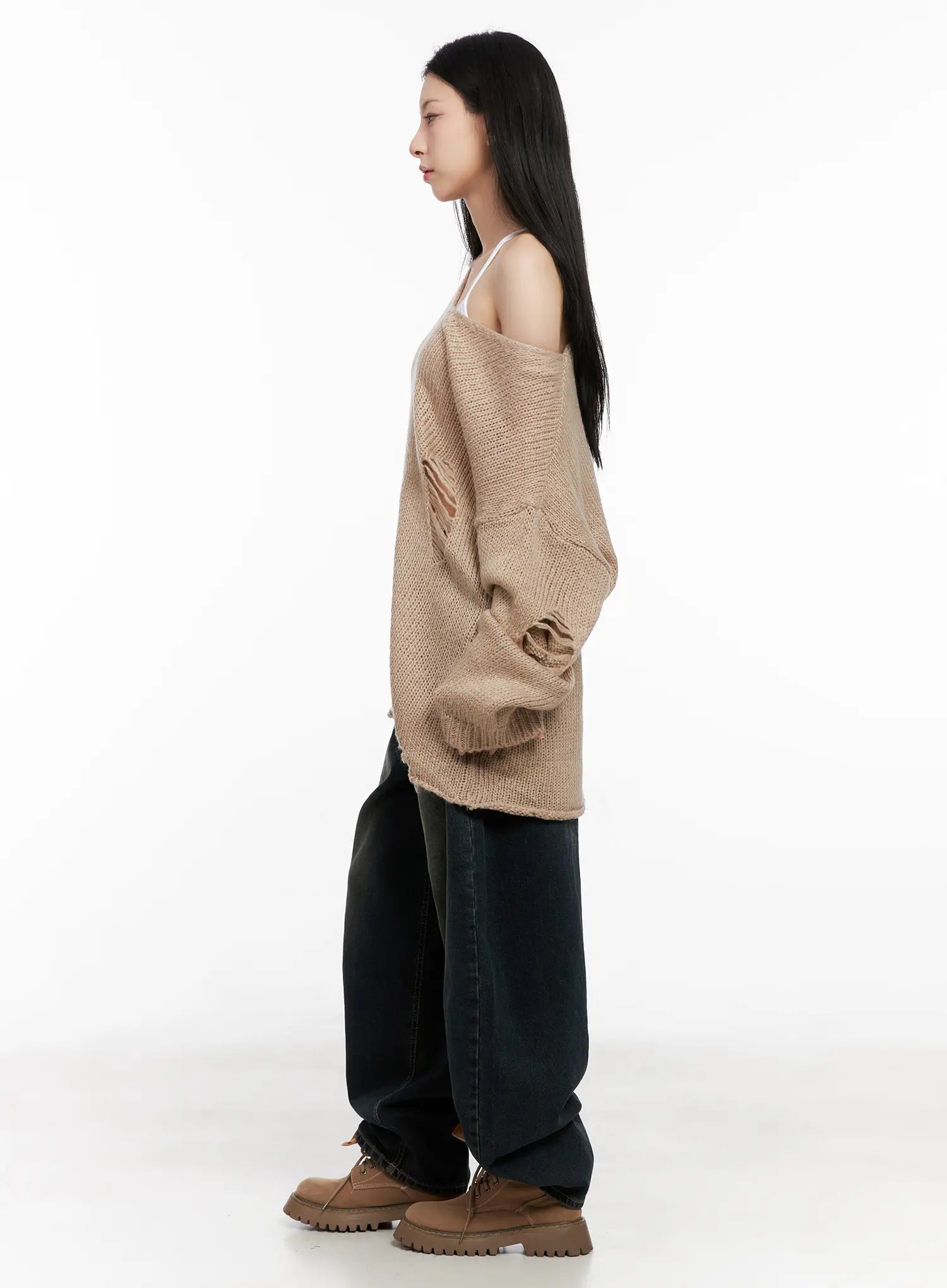 Hyer Washed Wide-Leg Jeans CG522 in dark blue, side profile full-length view on model, wide-fit long denim with washed gradient, worn with oversized distressed knit top and chunky boots.