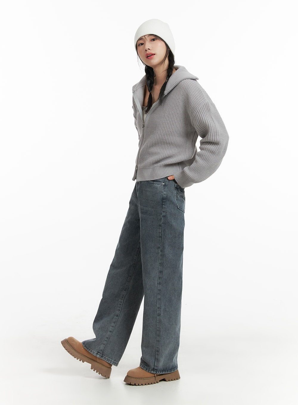 Blue Washed Straight Jeans OM408 in gray, side-angle full-body shot on model, straight-leg washed denim, styled with gray ribbed zip knit and white beanie.