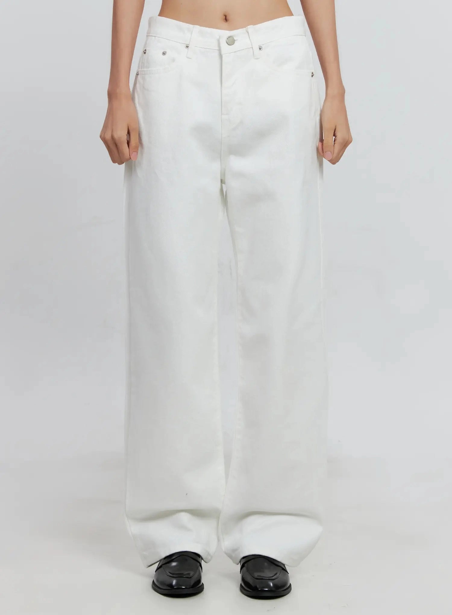Taytum Straight-Leg Jeans IS515 in white, front mid-body view on model, low-rise straight-leg cotton denim showing five-pocket design and silver button closure.