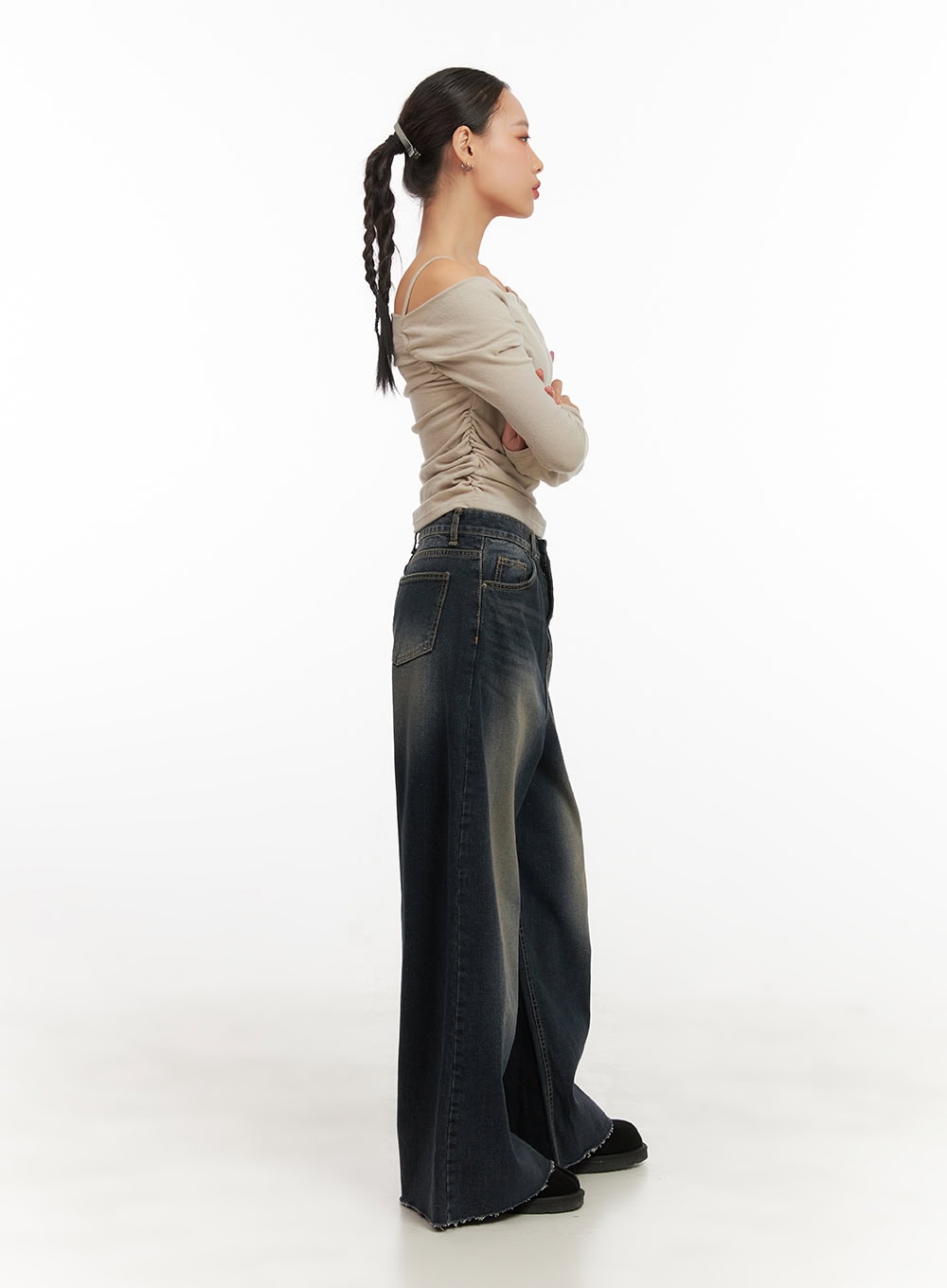 Tasha Low Waist Washed Wide Leg Jeans CD410 in dark blue, full-length side profile on model, low-rise wide-leg denim with vintage wash, frayed hem pooling at floor, paired with off-shoulder beige top.