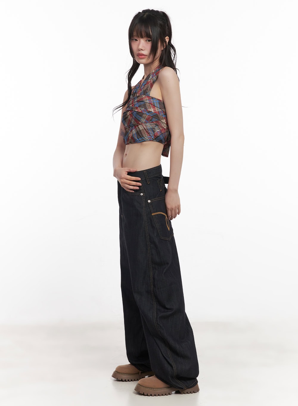 Jessie Stitched Wide-Leg Jeans CY520 in dark blue, side view on model, showing exaggerated wide-leg silhouette, contrast topstitching, low rise, styled with plaid halter crop top and loafers.