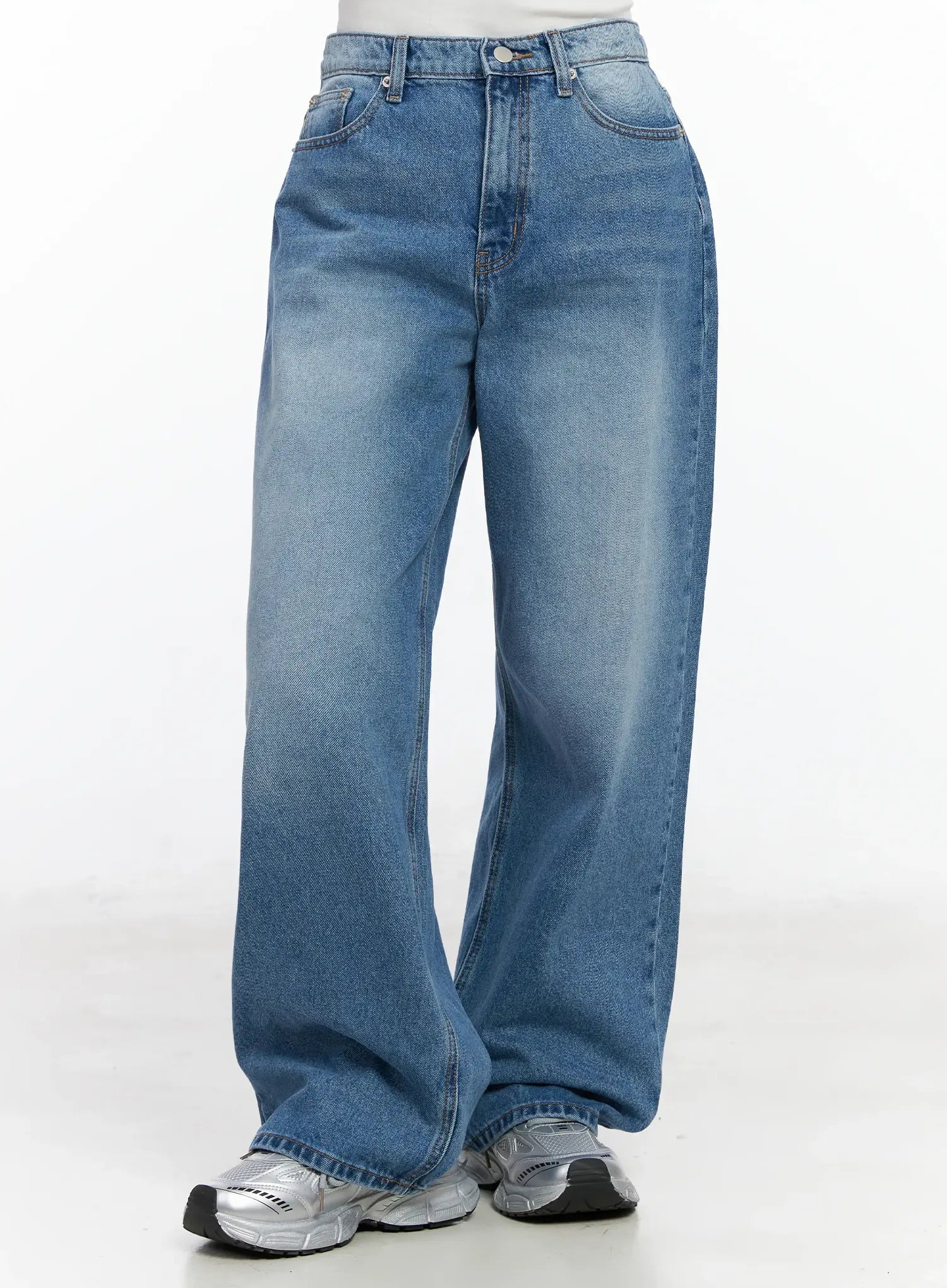 Iliana Wide Leg Jeans IJ529 in blue, front full-length crop view on model, wide-fit washed denim with high waist and five-pocket design, silver chunky sneakers.